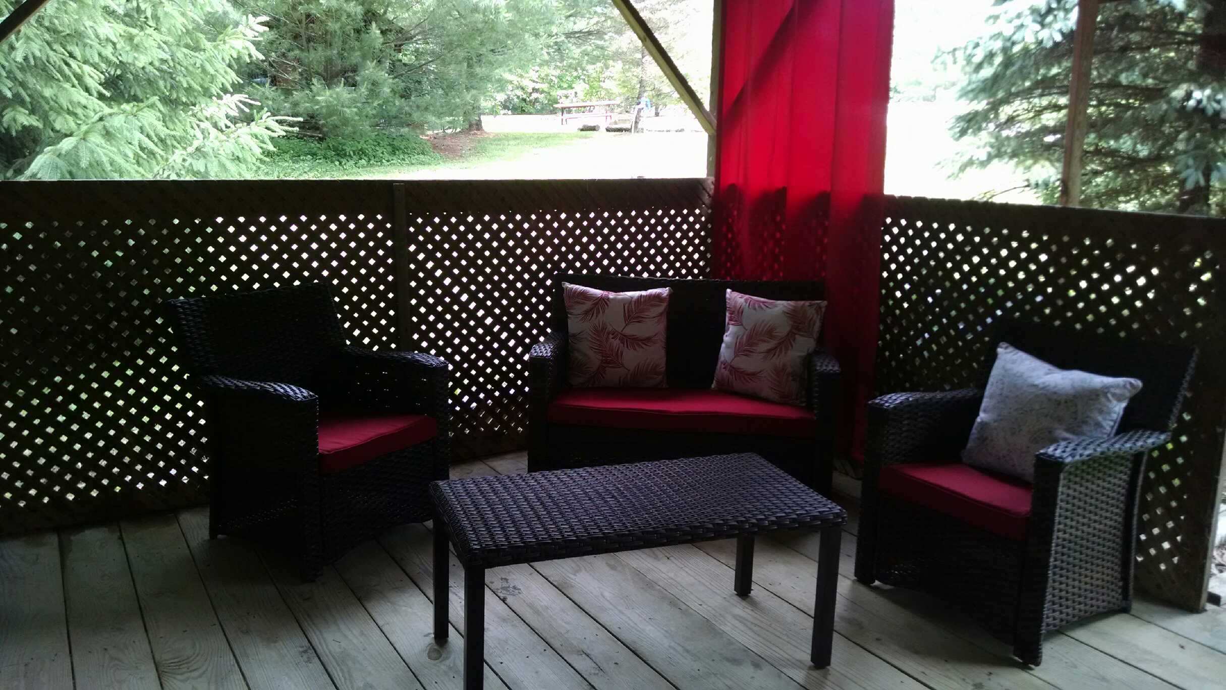 red pillow on sofa outdoors